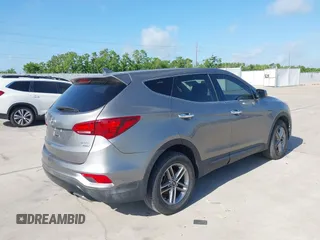 2017 Hyundai Santa Fe 2.4L z VIN 5XYZTDLB7HG444033, wystawiony jako IAAI lot #42263907 z przebiegiem 107 454 mil mil oraz . Historia ofert i sprzedaży dostępna na DreamBid. Obrazek 4.