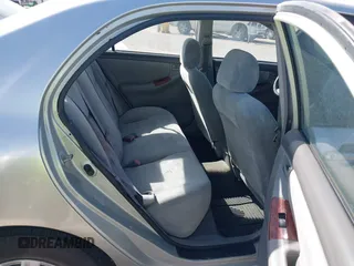 2004 Toyota Corolla CE with VIN 1NXBR32E64Z283247, listed as a IAAI auction lot 42121254 with 292,754 mi miles. Bid and sale history available at carsss.com. Image 8.