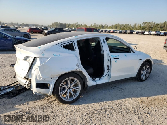 2023 Tesla Model Y Long Range z VIN 7SAYGDEE8PA069248, wystawiony jako Copart lot #74120944 z przebiegiem 17 085 mil mil oraz Szkoda całkowita • Salvage title. Historia ofert i sprzedaży dostępna na DreamBid. Obrazek 3.