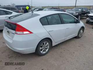 2010 Honda Insight EX with VIN JHMZE2H71AS035091, listed as a IAAI auction lot 41380128 with 181,653 mi miles and . Bid and sale history available at DreamBid. Image 4.