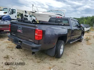 2015 GMC Sierra 3500HD Denali z VIN 1GT424E87FF588292, wystawiony jako Copart lot #65950764 z przebiegiem 128 416 mil mil oraz Szkoda całkowita • Salvage title. Historia ofert i sprzedaży dostępna na DreamBid. Obrazek 4.
