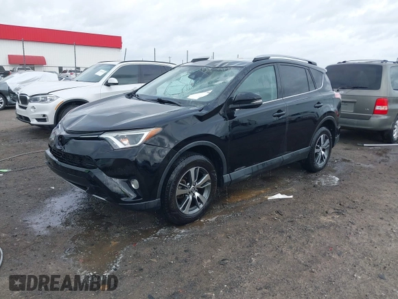2018 Toyota RAV4 XLE with VIN 2T3WFREV9JW412755, listed as a IAAI auction lot 41889960 with 216,451 mi miles and . Bid and sale history available at carsss.com. Image 18.