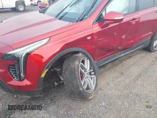 2021 Cadillac XT4 AWD Sport with VIN 1GYFZFR43MF006039, listed as a IAAI auction lot 41845105 with 19,289 mi miles and . Bid and sale history available at DreamBid. Image 6.