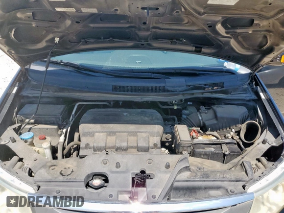 2011 Honda Odyssey Touring with VIN 5FNRL5H90BB033700, listed as a Copart auction lot 58602835 with 197,063 mi miles and Clean title. Bid and sale history available at DreamBid. Image 12.