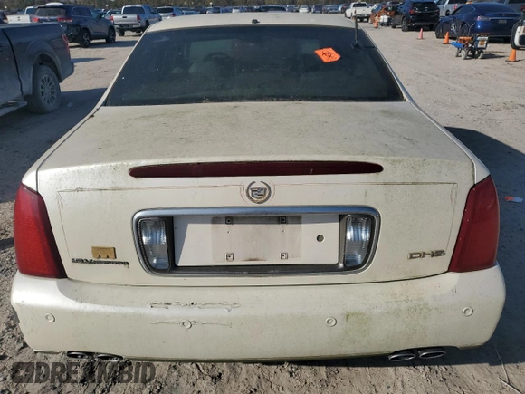 2003 Cadillac DeVille DHS z VIN 1G6KE57Y03U116432, wystawiony jako Copart lot #85949594 z przebiegiem 204 321 mil mil oraz Czysty tytuł • Clean title. Historia ofert i sprzedaży dostępna na DreamBid. Obrazek 6.