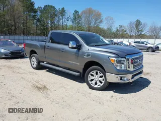 2016 Nissan Titan XD Platinum Reserve with VIN 1N6BA1F29GN514380, listed as a IAAI auction lot 41894389 with 143,616 mi miles. Bid and sale history available at carsss.com. Image 1.