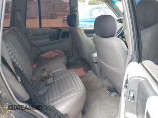 1994 Jeep Grand Cherokee Laredo z VIN 1J4GZ58Y2RC320793, wystawiony jako IAAI lot #42781115 z przebiegiem 275 518 mil mil oraz . Historia ofert i sprzedaży dostępna na DreamBid. Obrazek 8.