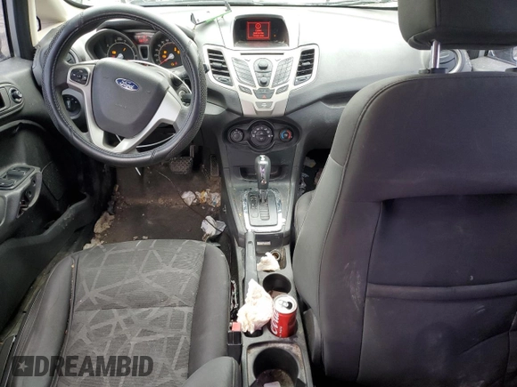 2012 Ford Fiesta SE z VIN 3FADP4BJ4CM125634, wystawiony jako Copart lot #59911995 z przebiegiem 168 371 mil mil oraz Czysty tytuł • Clean title. Historia ofert i sprzedaży dostępna na DreamBid. Obrazek 8.