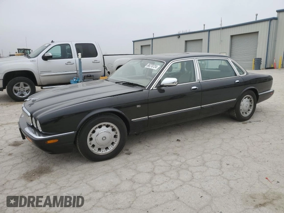 1999 Jaguar XJ z VIN SAJKD6043XC872105, wystawiony jako Copart lot #86270724 z przebiegiem Nie podano mil oraz Szkoda całkowita • Salvage title. Historia ofert i sprzedaży dostępna na DreamBid. Obrazek 1.