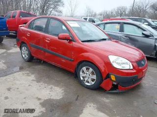2009 Kia Rio SX with VIN KNADE223796561406, listed as a IAAI auction lot 41650749 with 100,041 mi miles. Bid and sale history available at carsss.com. Image 1.