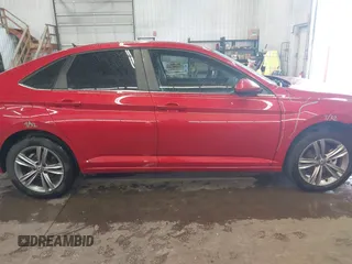 2023 Volkswagen Jetta SE with VIN 3VWEM7BUXPM057216, listed as a IAAI auction lot 42303031 with 30,591 mi miles and . Bid and sale history available at DreamBid. Image 14.