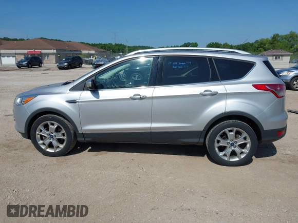 2015 Ford Escape Titanium with VIN 1FMCU9J94FUA65188, listed as a IAAI auction lot 42516728 with 65,969 mi miles and . Bid and sale history available at DreamBid. Image 14.