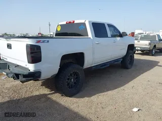 2015 Chevrolet Silverado 1500 LT with VIN 3GCUKREC1FG289851, listed as a IAAI auction lot 41676144 with 131,633 mi miles. Bid and sale history available at carsss.com. Image 4.
