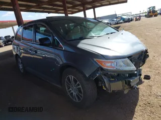 2012 Honda Odyssey EX-L with VIN 5FNRL5H6XCB103498, listed as a IAAI auction lot 42065658 with 104,933 mi miles and . Bid and sale history available at carsss.com. Image 1.
