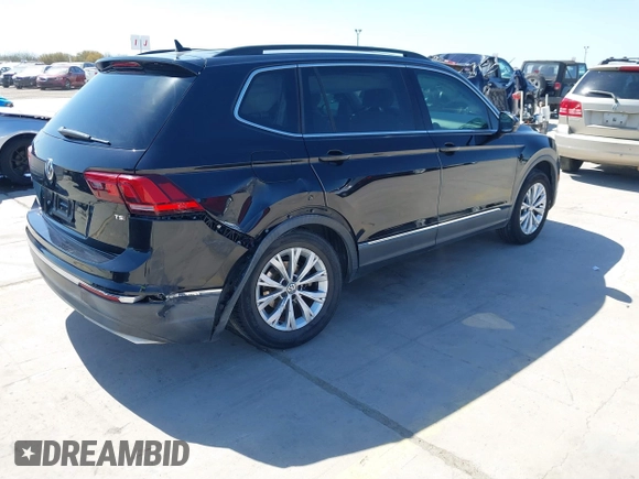 2018 Volkswagen Tiguan SEL with VIN 3VV3B7AX3JM064061, listed as a IAAI auction lot 41772564 with 95,395 mi miles and . Bid and sale history available at DreamBid. Image 4.