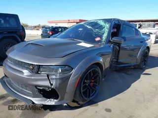 2022 Dodge Charger Scat Pack Widebody with VIN 2C3CDXGJ1NH204130, listed as a IAAI auction lot 41392893 with 9,515 mi miles and . Bid and sale history available at DreamBid. Image 17.