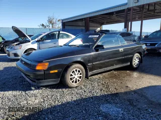 1988 Toyota Celica z VIN JT5ST62K3J7264934, wystawiony jako Copart lot #76699114 z przebiegiem 116 091 mil mil oraz Nie do naprawy. Historia ofert i sprzedaży dostępna na DreamBid. Obrazek 1.