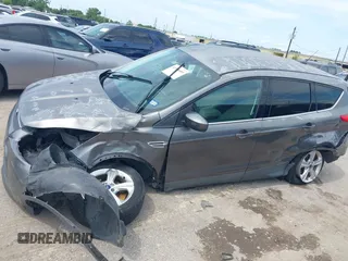 2014 Ford Escape SE z VIN 1FMCU9GX9EUC01478, wystawiony jako IAAI lot #42370409 z przebiegiem 158 154 mil mil oraz . Historia ofert i sprzedaży dostępna na DreamBid. Obrazek 6.
