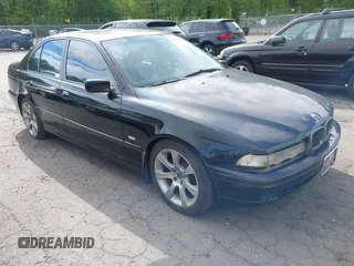 1997 BMW 5 Series 540i z VIN WBADE5324VBV92704, wystawiony jako IAAI lot #42305703 z przebiegiem 202 371 mil mil oraz . Historia ofert i sprzedaży dostępna na DreamBid. Obrazek 1.