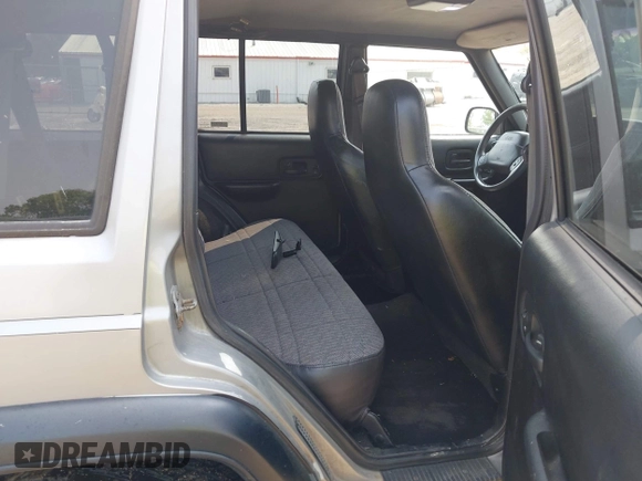 2000 Jeep Cherokee with VIN 1J4FF48S5YL159414, listed as a IAAI auction lot 42416639 with 177,932 mi miles and . Bid and sale history available at DreamBid. Image 8.