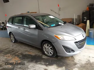 2012 Mazda 5 Sport z VIN JM1CW2BL0C0129522, wystawiony jako IAAI lot #42500392 z przebiegiem 178 074 mil mil oraz . Historia ofert i sprzedaży dostępna na DreamBid. Obrazek 1.