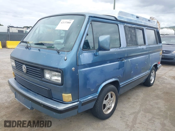 1989 Volkswagen Vanagon with VIN WV2YB0252KH059286, listed as a IAAI auction lot 42137080 with 130,604 mi miles and . Bid and sale history available at DreamBid. Image 2.