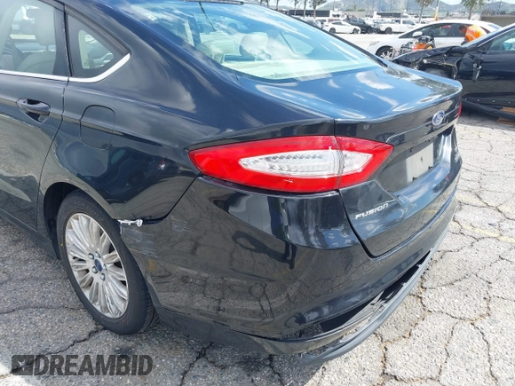 2015 Ford Fusion SE Hybrid with VIN 3FA6P0LU7FR199065, listed as a IAAI auction lot 41944181 with 197,020 mi miles. Bid and sale history available at carsss.com. Image 17.