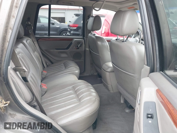1999 Jeep Grand Cherokee Limited with VIN 1J4GW68N7XC739479, listed as a IAAI auction lot 41448323 with 129,840 mi miles. Bid and sale history available at carsss.com. Image 8.