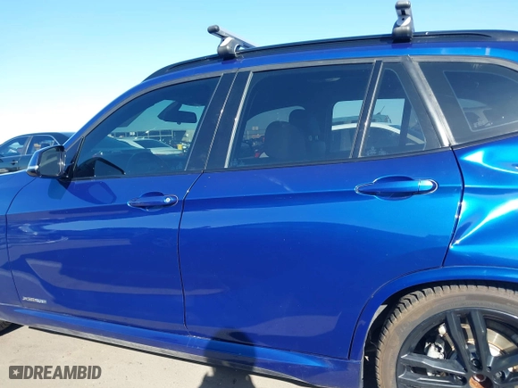 2015 BMW X1 xDrive28i with VIN WBAVL1C56FVY32753, listed as a IAAI auction lot 41759454 with 130,823 mi miles. Bid and sale history available at carsss.com. Image 14.