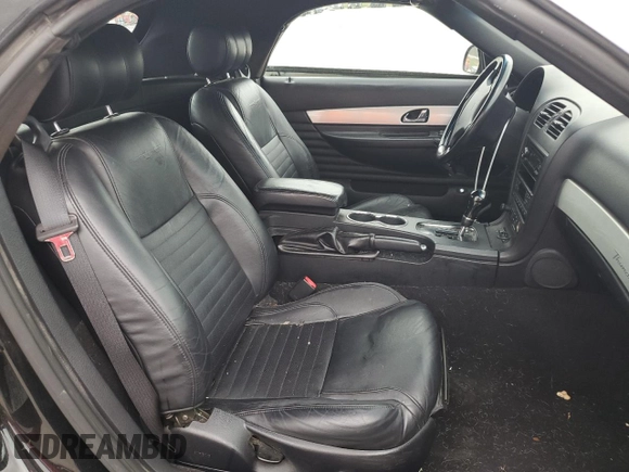 2003 Ford Thunderbird Deluxe z VIN 1FAHP60AX3Y101570, wystawiony jako Copart lot #51546865 z przebiegiem 108 736 mil mil oraz Szkoda całkowita • Salvage title. Historia ofert i sprzedaży dostępna na DreamBid. Obrazek 10.