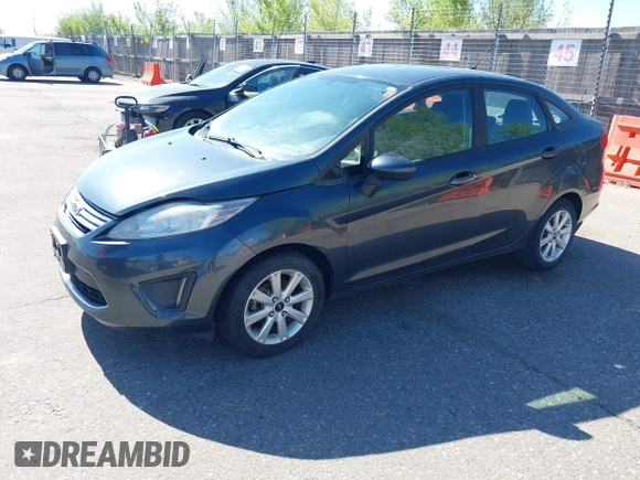 2011 Ford Fiesta SE with VIN 3FADP4BJ7BM135864, listed as a IAAI auction lot 42134479 with 118,573 mi miles. Bid and sale history available at carsss.com. Image 2.