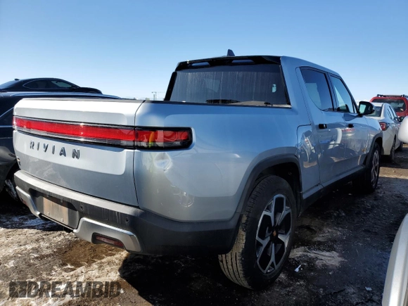 2023 Rivian R1T Adventure z VIN 7FCTGAAA5PN017311, wystawiony jako Copart lot #42523755 z przebiegiem 35 039 mil mil oraz Szkody całkowita. Historia ofert i sprzedaży dostępna na DreamBid. Obrazek 3.