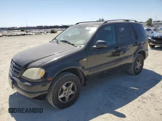 2000 Mercedes-Benz M 320/430/500 with VIN 4JGAB54E4YA150907, listed as a Copart auction lot 61649225 with 74,652 mi miles and Salvage title. Bid and sale history available at DreamBid. Image 1.