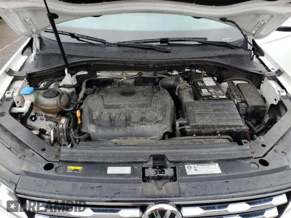 2018 Volkswagen Tiguan S z VIN 3VV1B7AXXJM056479, wystawiony jako Copart lot #53113125 z przebiegiem 99 367 mil mil oraz Szkoda całkowita • Salvage title. Historia ofert i sprzedaży dostępna na DreamBid. Obrazek 13.