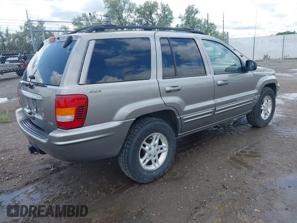 1999 Jeep Grand Cherokee Limited z VIN 1J4GW68N3XC597468, wystawiony jako IAAI lot #42353732 z przebiegiem 201 388 mil mil oraz . Historia ofert i sprzedaży dostępna na DreamBid. Obrazek 4.