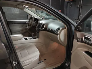 2011 Jeep Grand Cherokee 70th Anniversary with VIN 1J4RR4GG3BC566690, listed as a IAAI auction lot 41810545 with 173,886 mi miles. Bid and sale history available at carsss.com. Image 5.