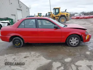2000 Mazda Protege DX with VIN JM1BJ2224Y0277889, listed as a IAAI auction lot 41160593 with 124,586 mi miles and . Bid and sale history available at DreamBid. Image 13.