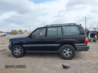 2001 Toyota Land Cruiser z VIN JTEHT05J812001099, wystawiony jako IAAI lot #42057630 z przebiegiem Nie podano mil oraz . Historia ofert i sprzedaży dostępna na DreamBid. Obrazek 13.