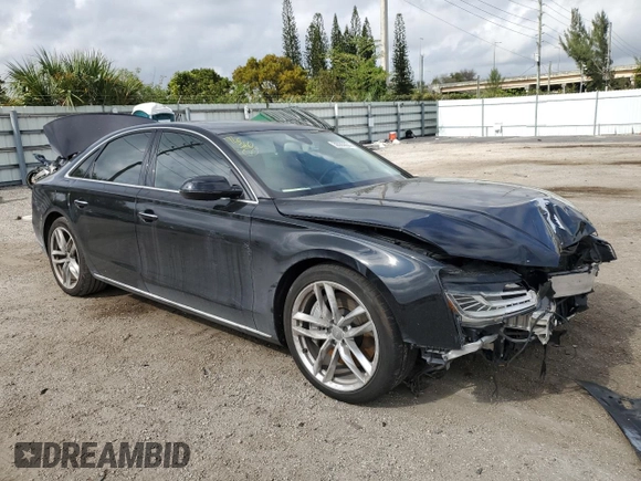 2015 Audi A8 4.0T with VIN WAUJ2AFD5FN013267, listed as a Copart auction lot 39065654 with 64,541 mi miles and . Bid and sale history available at DreamBid. Image 4.