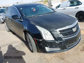 2016 Cadillac XTS Luxury Collection z VIN 2G61M5S38G9143956, wystawiony jako IAAI lot #42259257 z przebiegiem 158 437 mil mil oraz . Historia ofert i sprzedaży dostępna na DreamBid. Obrazek 1.