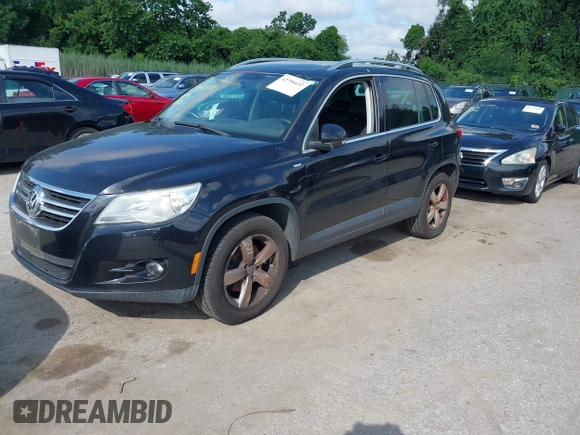 2010 Volkswagen Tiguan with VIN WVGAV9AX4AW513705, listed as a IAAI auction lot 42756432 with 212,980 mi miles and . Bid and sale history available at DreamBid. Image 2.