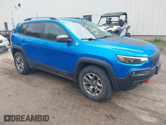 2021 Jeep Cherokee Trailhawk with VIN 1C4PJMBXXMD173102, listed as a IAAI auction lot 42205402 with 57,321 mi miles and . Bid and sale history available at DreamBid. Image 1.