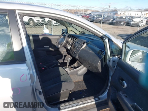 2012 Nissan Versa S with VIN 3N1BC1CP2CK213563, listed as a IAAI auction lot 41339306 with 61,581 mi miles. Bid and sale history available at carsss.com. Image 5.