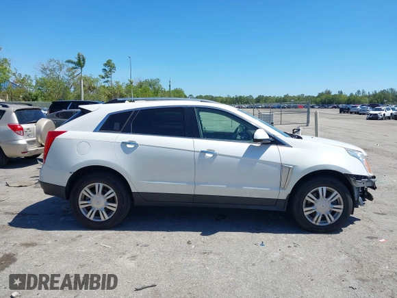 2016 Cadillac SRX Luxury Collection z VIN 3GYFNEE34GS513728, wystawiony jako IAAI lot #41847871 z przebiegiem 109 045 mil mil oraz . Historia ofert i sprzedaży dostępna na DreamBid. Obrazek 13.
