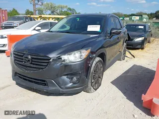 2016 Mazda CX-5 Grand Touring with VIN JM3KE2DYXG0769578, listed as a IAAI auction lot 41504987 with 96,541 mi miles. Bid and sale history available at carsss.com. Image 22.