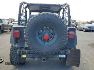 1990 Jeep Wrangler with VIN 2J4FY29T5LJ537896, listed as a Copart auction lot 57021295 with 143,753 mi miles and Clean title. Bid and sale history available at DreamBid. Image 6.