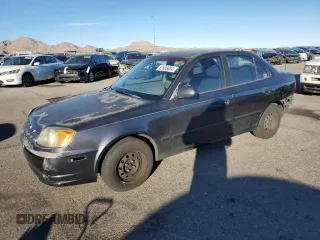 2005 Hyundai Accent GLS with VIN KMHCG45C95U665574, listed as a Copart auction lot 82603804 with 154,187 mi miles and Salvage Title. Bid and sale history available at carsss.com. Image 1.