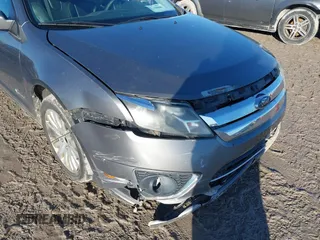 2010 Ford Fusion Hybrid with VIN 3FADP0L39AR125251, listed as a IAAI auction lot 41100606 with 235,612 mi miles. Bid and sale history available at carsss.com. Image 6.
