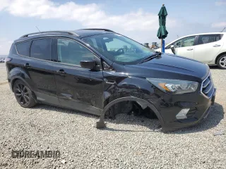 2017 Ford Escape SE z VIN 1FMCU0G92HUD20328, wystawiony jako Copart lot #55181485 z przebiegiem Nie podano mil oraz Szkoda całkowita • Salvage title. Historia ofert i sprzedaży dostępna na DreamBid. Obrazek 4.