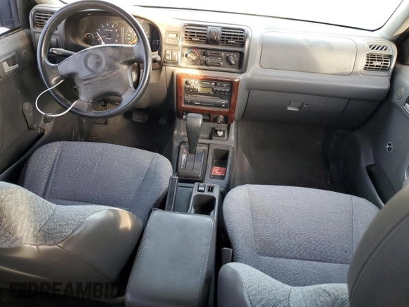 1999 Isuzu Rodeo S with VIN 4S2CK58W2X4361475, listed as a Copart auction lot 63873864 with 232,406 mi miles and Salvage Title. Bid and sale history available at DreamBid. Image 8.